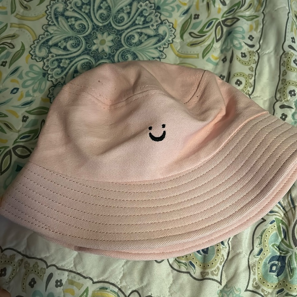 Pink smiley face/night call bucket hat